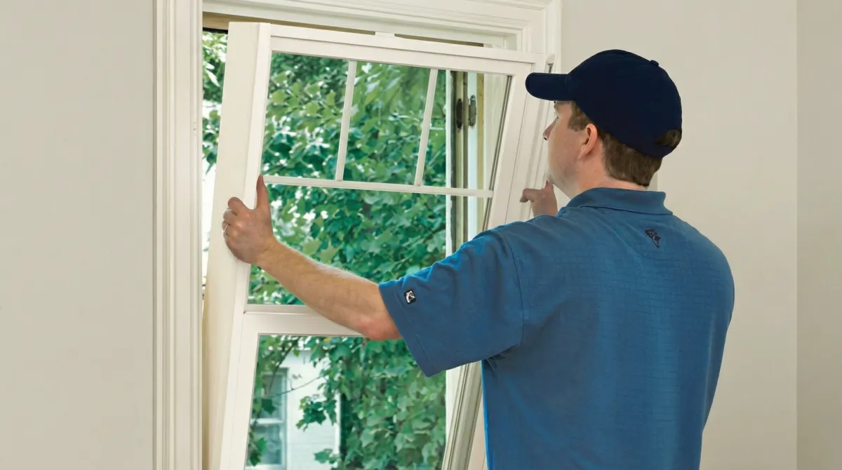Professional contractors performing a residential window insulation and replacement service in Aurora, IL